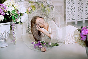 Young spring fashion woman in spring lux vintage interior. Springtime. Trendy girl on a luxury spring background. Allergic to pol