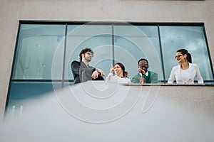 Young startup business team having an outdoor meeting in an urban city setting.