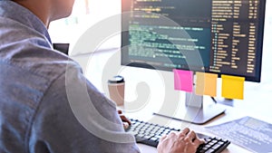 Young startup Programmers Sitting At Desks Working On Computers screen for Developing programming and coding to find solution to