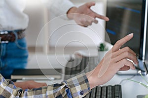 Young startup Programmers Sitting At Desks Working On Computers screen for Developing programming and coding to find solution to