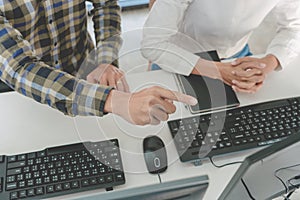 Young startup Programmers Sitting At Desks Working On Computers screen for Developing programming and coding to find solution to