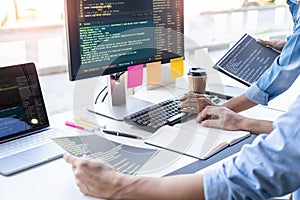 Young startup Programmers Sitting At Desks Working On Computers screen for Developing programming and coding to find solution to