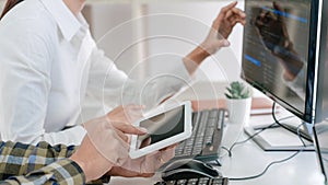 Young startup Programmers Sitting At Desks Working On Computers screen for Developing programming and coding to find solution to