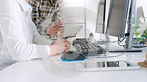 Young startup Programmers Sitting At Desks Working On Computers screen for Developing programming and coding to find solution to