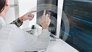 Young startup Programmers Sitting At Desks Working On Computers screen for Developing programming and coding to find solution to