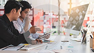 Young startup ux ui front end designers developing programming and coding responsive web content or mobile app from prototype and