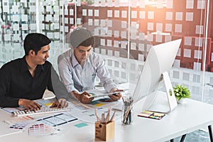 Young startup ux ui front end designers developing programming and coding responsive web content or mobile app from prototype and