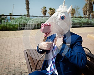 Young strange man is dressed up a suit on background of city street