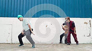 Young street dancer dancing in hip hop style with friend cheer behind. hiphop.