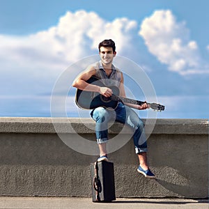 Young street guitarist