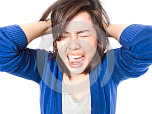 Young stress woman going crazy pulling her hair in frustration o