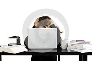 Young stressed out woman sitting at desk studying