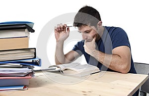 Young stressed student studying on library for exam in stress fe