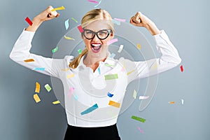 Young strong business woman celebrating