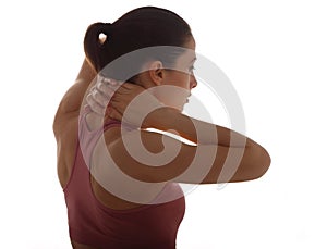 Young strong sporty woman suffering from chronic neck pain. Touching and massaging the hands. Closeup portrait isolated