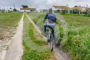 Young student with backpack and bicycle. Go to school. Copy spac