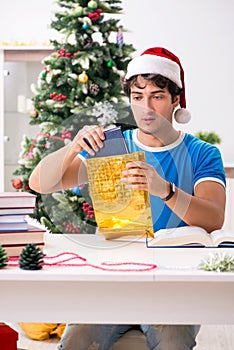 The young student with book at christmas eve