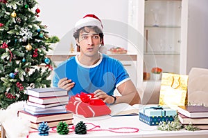 The young student with book at christmas eve