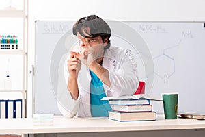 Young student chemist in the classroom