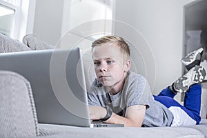 Young student doing online school work from home