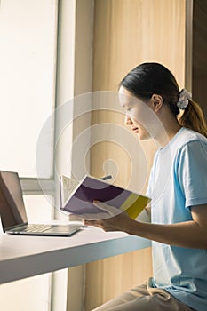 Young student eagerly enters the classroom, ready to immerse themselves in world of learning and education at college, studying