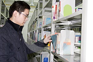 Young student finds books in library