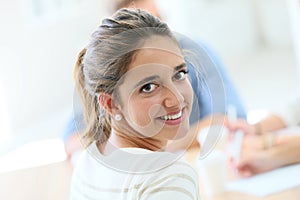 Young student girl attending class