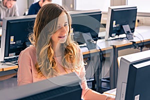 Young Student Girl Female in Bright Computer Lab University Classroom Learning Working Studying Using