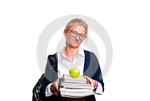 Young student girl holding books. Back to school