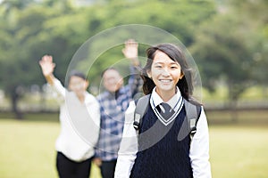 Young student girl with parent in school