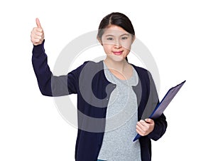 Young student hold with clipboard and thumb up
