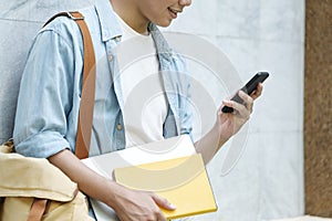 Young student man using mobilephone