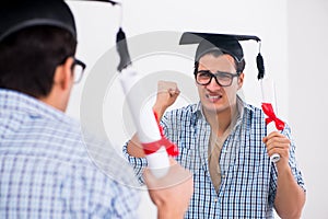 The young student planning graduation speech in front of mirror