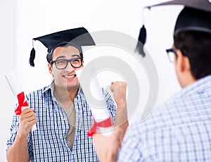 Young student planning graduation speech in front of mirror