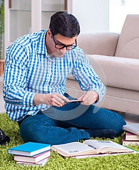 Young student preparing for exams at home
