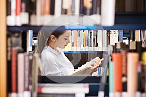 Young student searching for books