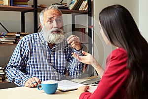 Young student and senior bearded professor