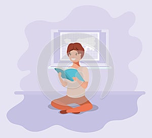 Young student sitting reading book