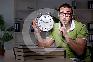 Young student studying at night at home