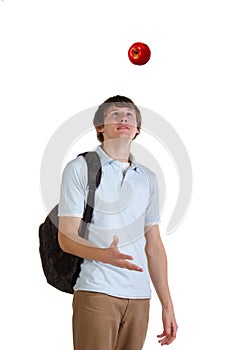 Young student throw up red apple