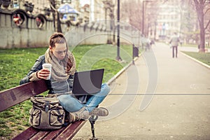 Young student Using laptop in park