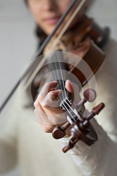 Young student violinist practice at home