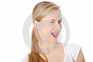 Young student woman with big smile blinking.