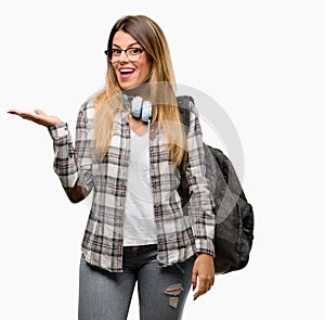 Young student woman with headphones and backpack