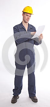 Young student worker with yellow helmet and paper isolated