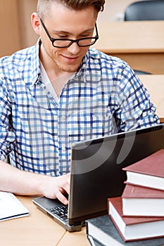 Young student working in a library