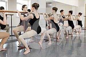 Young students ballerinas in choreography class of ballet school.