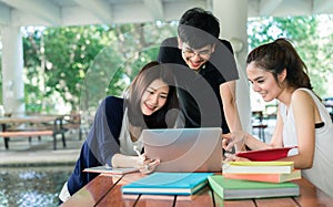 Young Students Group Consult with School Folders,Laptop Computer