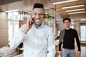 Young students in library looking at camera