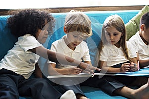 Young Students Reading Children Story Book photo